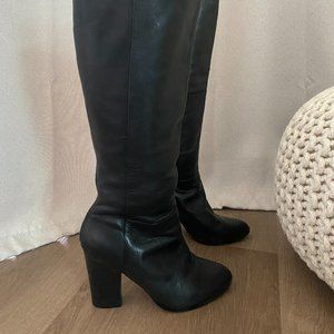Aldo calf tall boot with open back zipper design. 3 1/2 inch heel.
